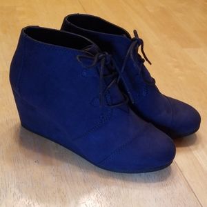 Women's navy wedge boots.
